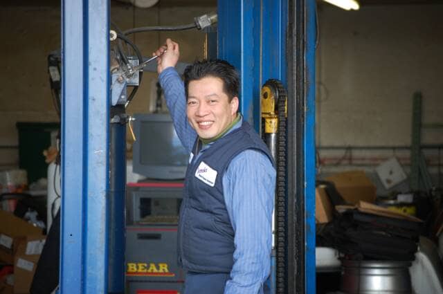 Owner Tony Nguyen posing for a photo in his shop